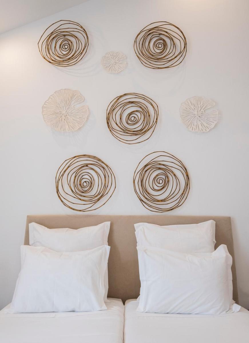 Uma cama ou camas num quarto em Aqua - Pópulo Eco Village