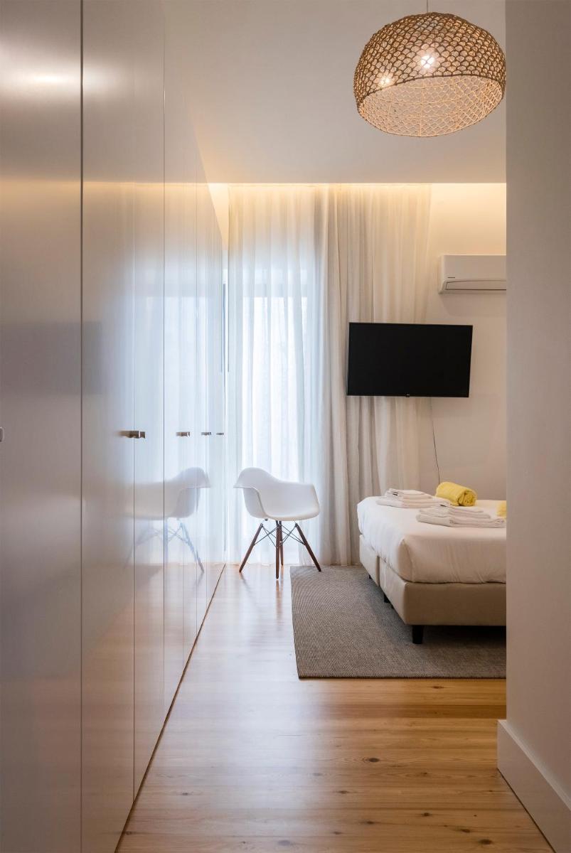 Uma cama ou camas num quarto em Aqua - Pópulo Eco Village