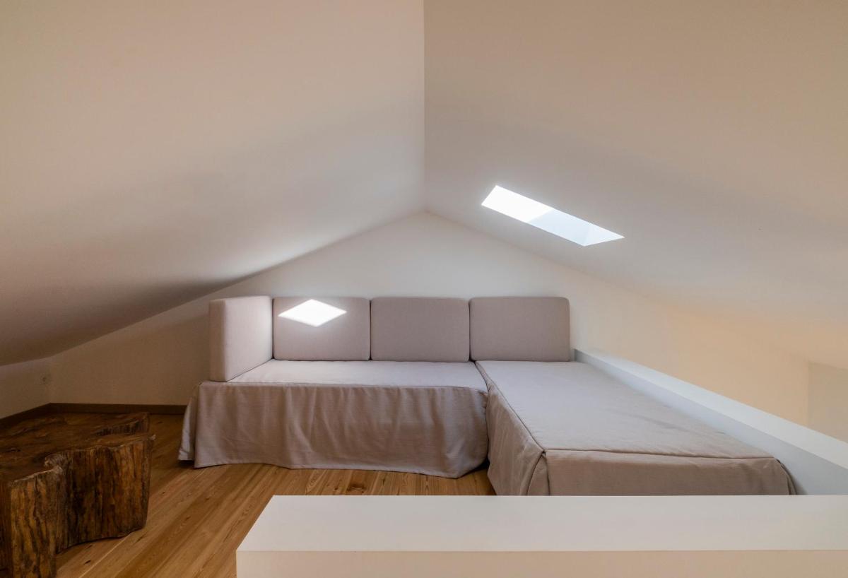 Uma cama ou camas num quarto em Aqua - Pópulo Eco Village