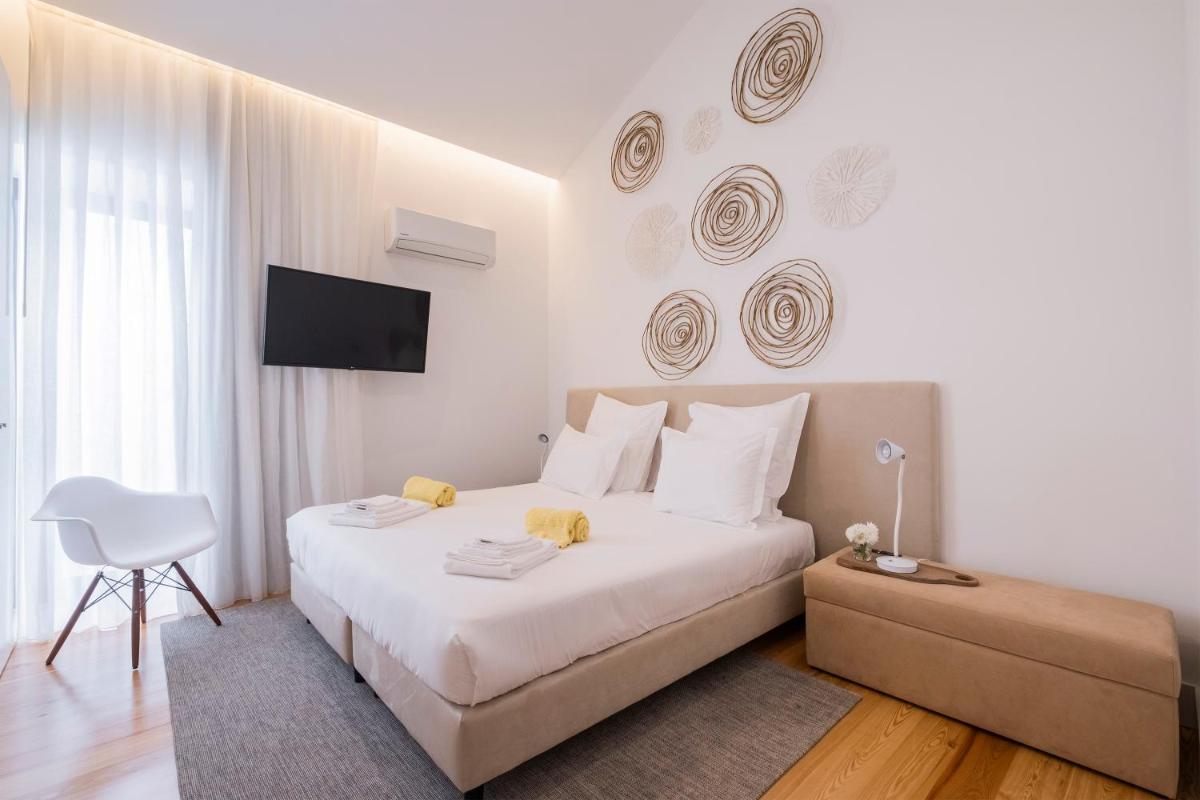 Uma cama ou camas num quarto em Aqua - Pópulo Eco Village