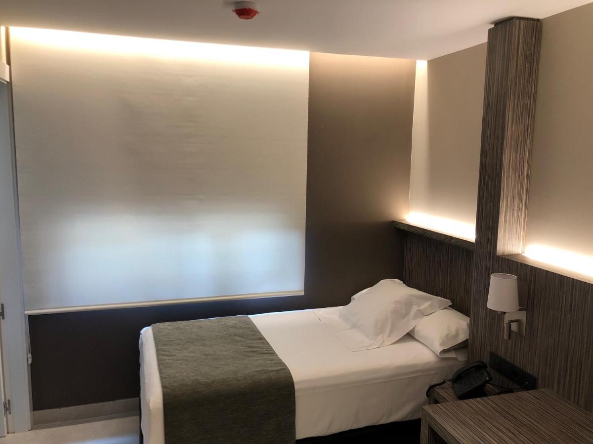Cama o camas de una habitación en Hotel Balneario de La Virgen