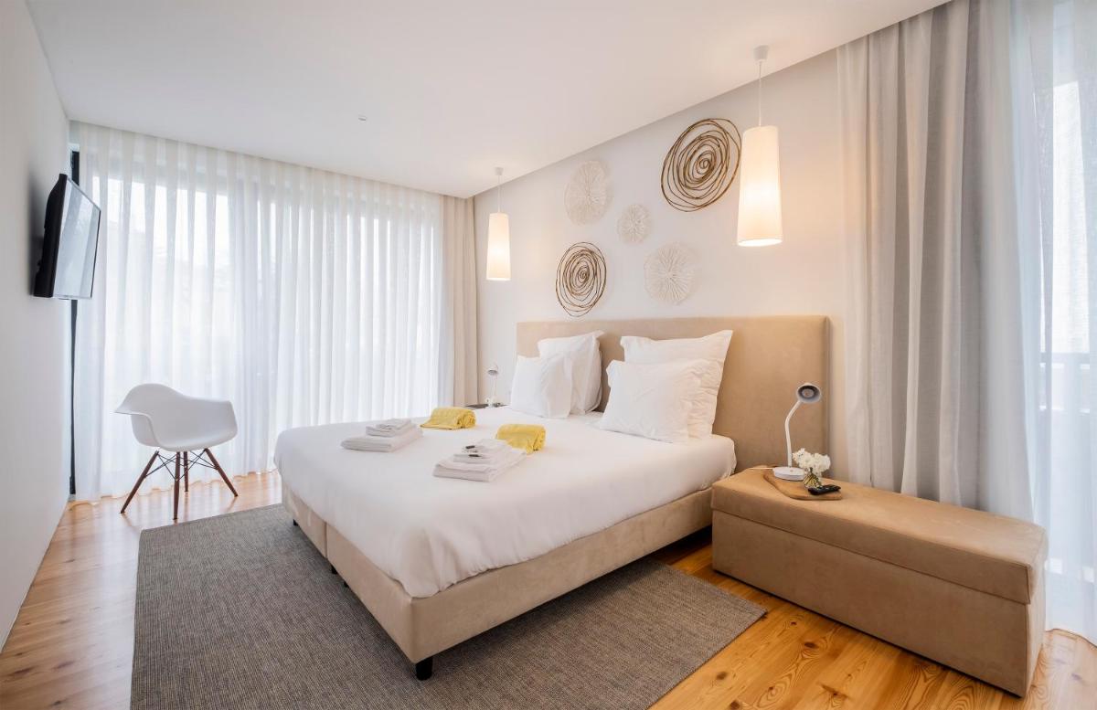 Uma cama ou camas num quarto em Aqua - Pópulo Eco Village