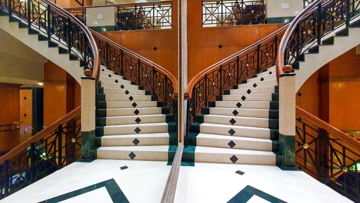 a spiral staircase in a building at The Orchid Hotel Mumbai Vile Parle in Mumbai