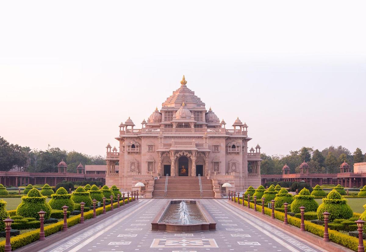 a building with a fountain in front of it at Crowne Plaza New Delhi Mayur Vihar Noida by IHG in New Delhi