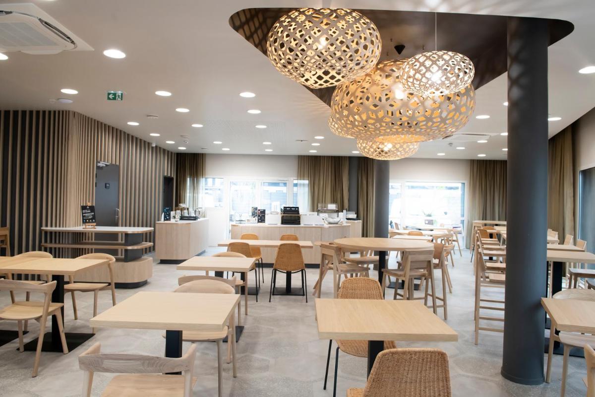 Restaurant ou autre lieu de restauration dans l'établissement Aparthotel & Spa Adagio Vannes