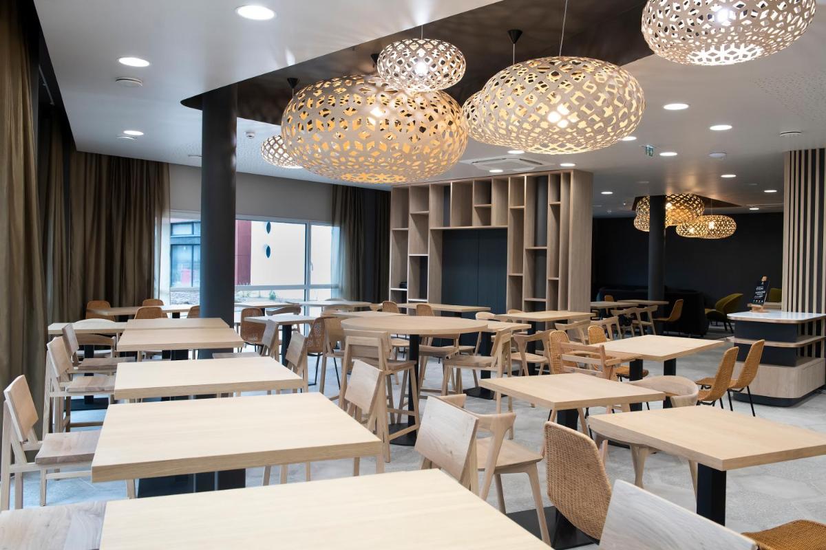 Restaurant ou autre lieu de restauration dans l'établissement Aparthotel & Spa Adagio Vannes