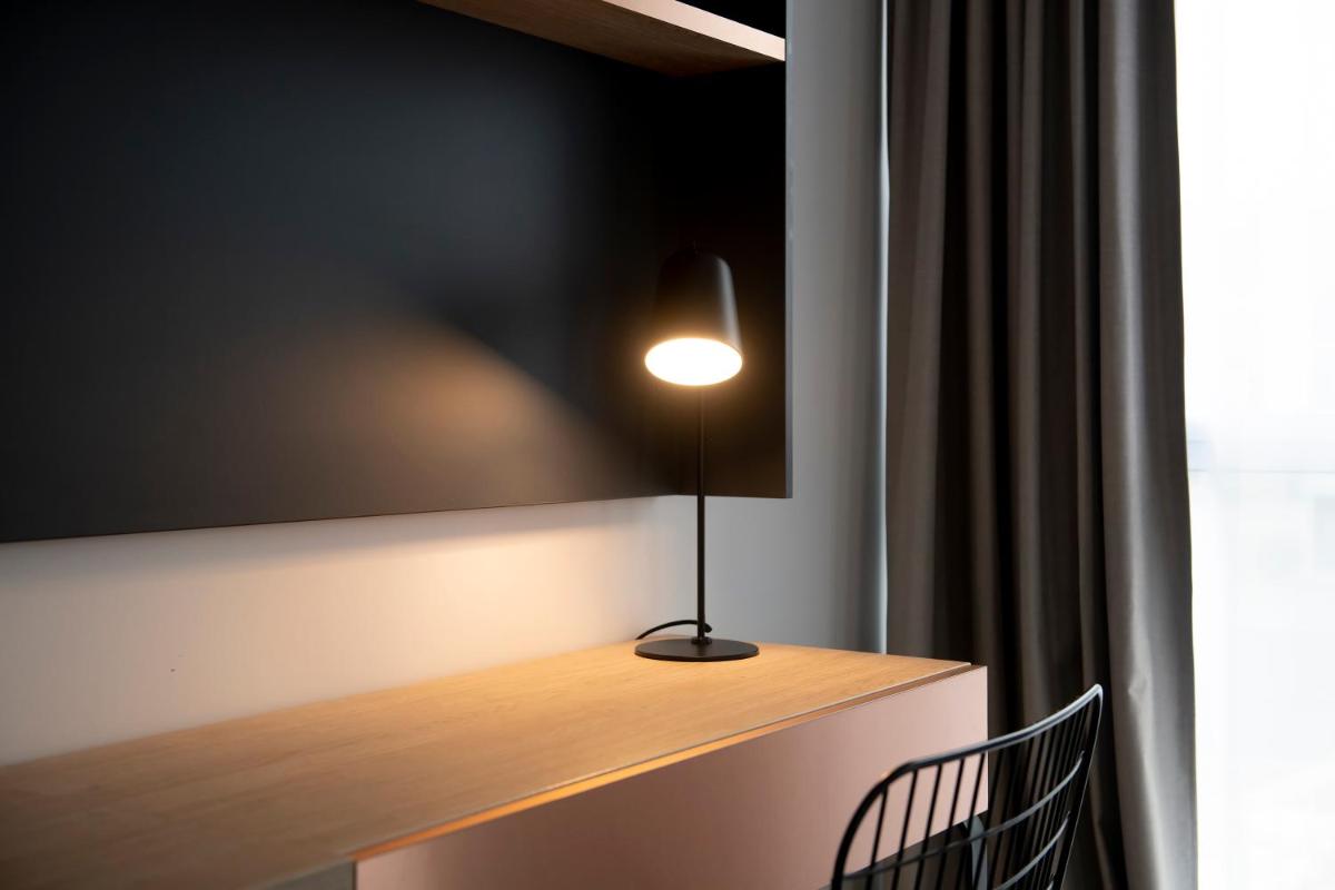 Télévision ou salle de divertissement dans l'établissement Aparthotel & Spa Adagio Vannes