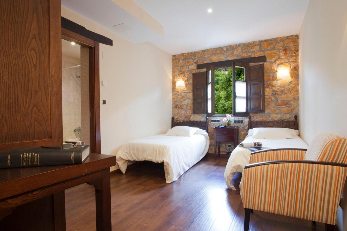 Cama o camas de una habitación en Hotel Rural El Fundil