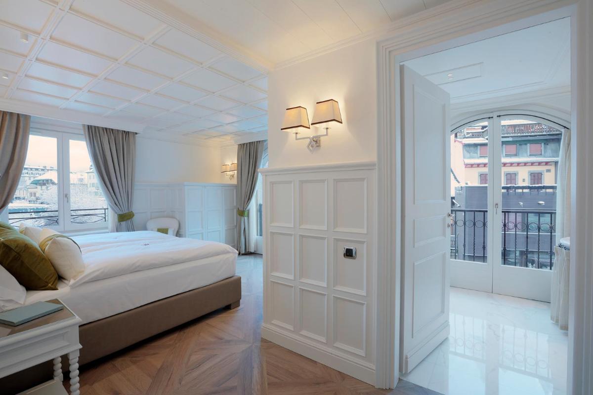 Un ou plusieurs lits dans un hébergement de l'établissement Grand Hôtel des Alpes