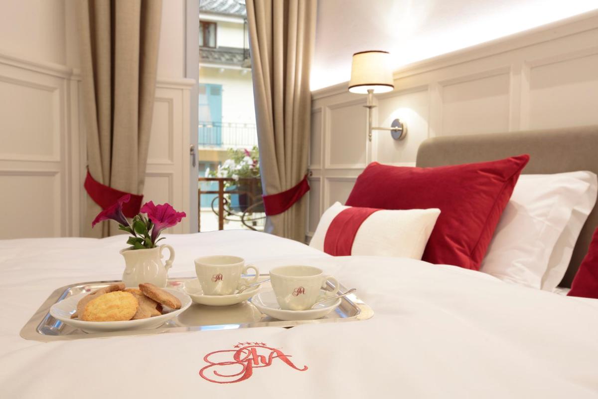 Un ou plusieurs lits dans un hébergement de l'établissement Grand Hôtel des Alpes
