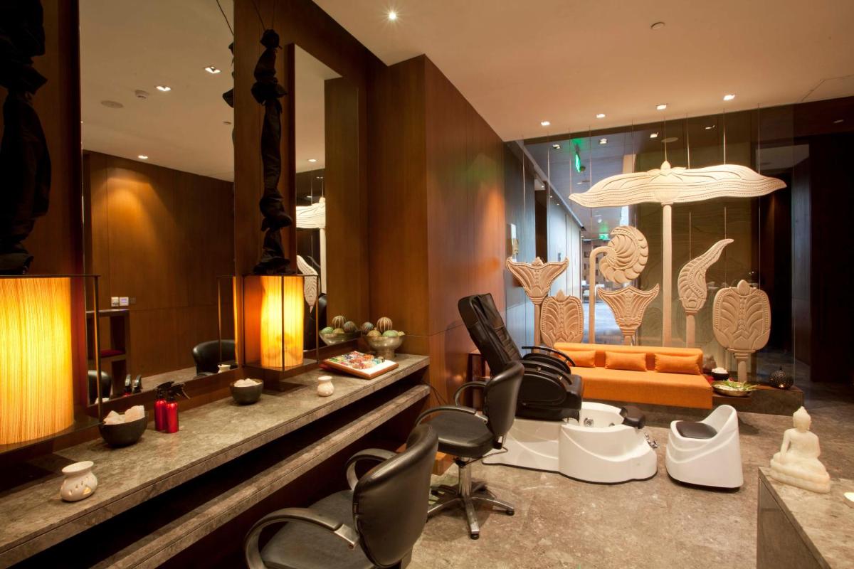 a living room with some chairs and a couch at Hyatt Regency Amritsar Hotel & Spa in Amritsar