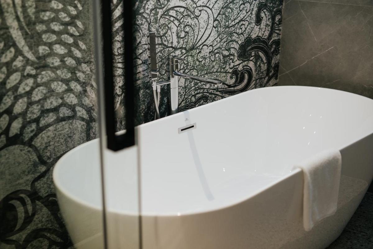 Un baño de Hotel Neptuno Playa & Spa