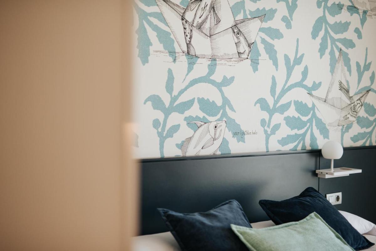 Cama o camas de una habitación en Hotel Neptuno Playa & Spa