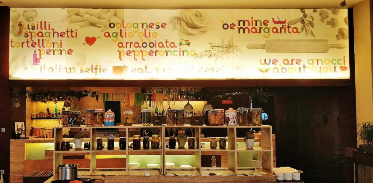 a store window with a shelf with bottles on it at Hyatt Hyderabad Gachibowli in Hyderabad