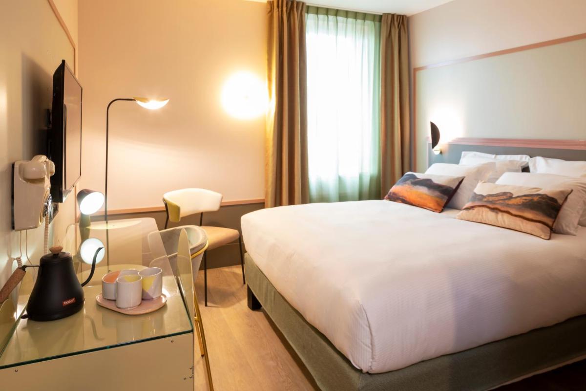 Un ou plusieurs lits dans un hébergement de l'établissement Aiden by Best Western Clermont-Ferrand Hotel & Spa