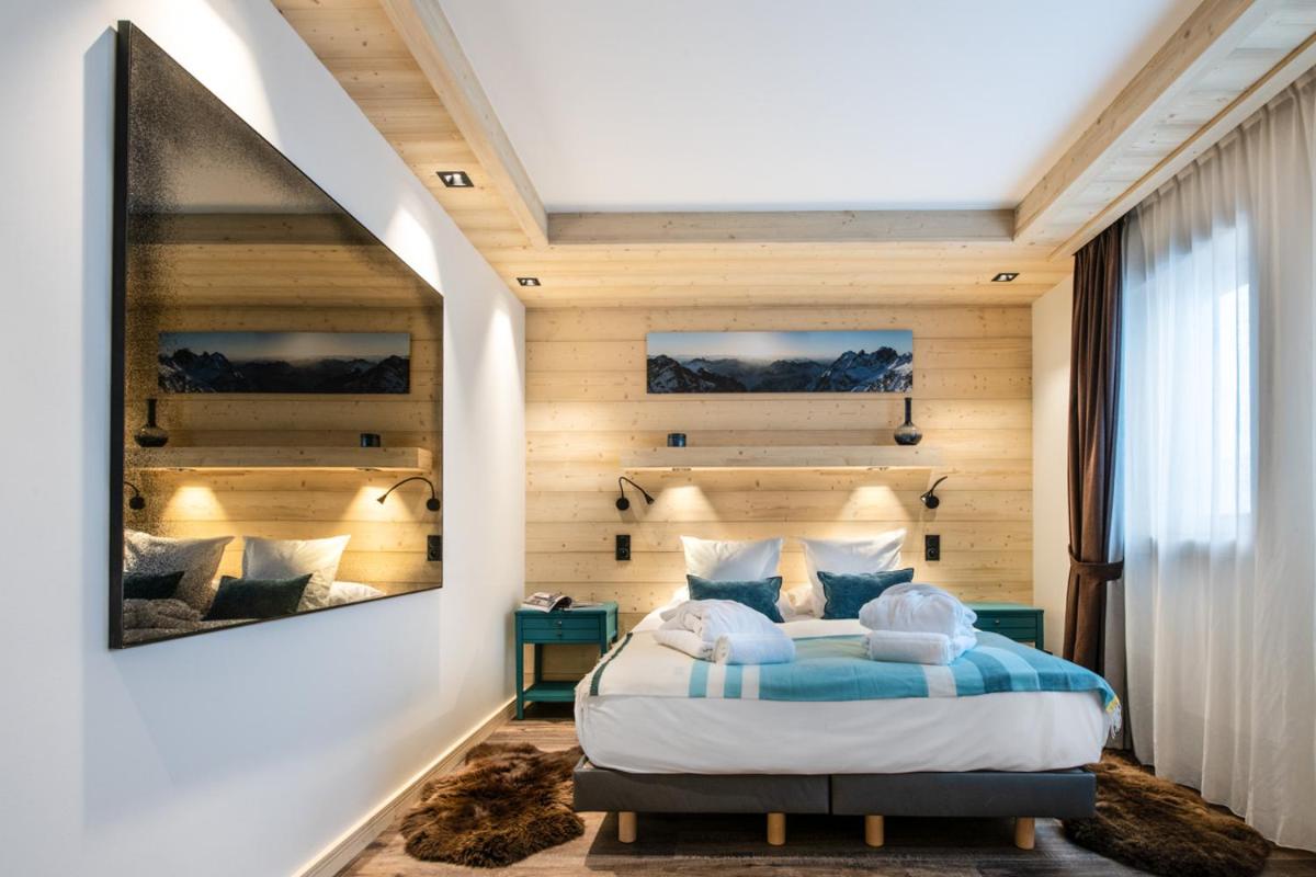 Un ou plusieurs lits dans un hébergement de l'établissement Manali Lodge by Alpine Resorts