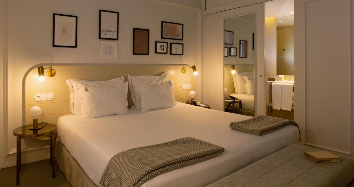 Uma cama ou camas num quarto em Lisboa Pessoa Hotel