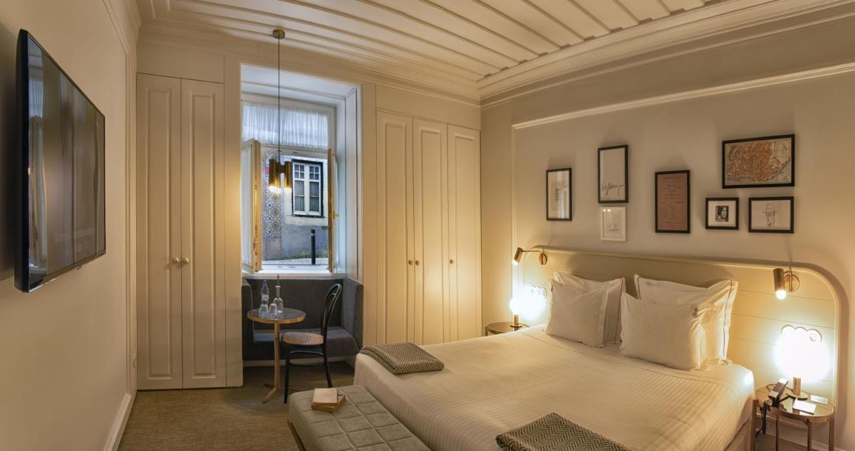 Uma cama ou camas num quarto em Lisboa Pessoa Hotel
