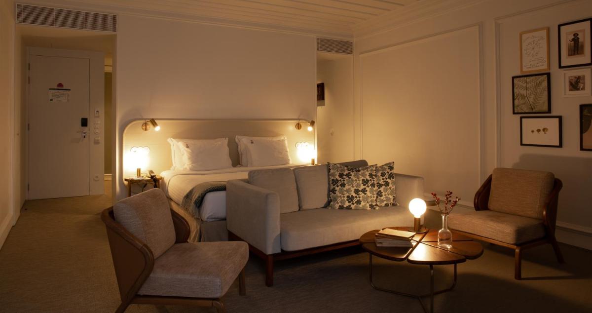 Uma cama ou camas num quarto em Lisboa Pessoa Hotel