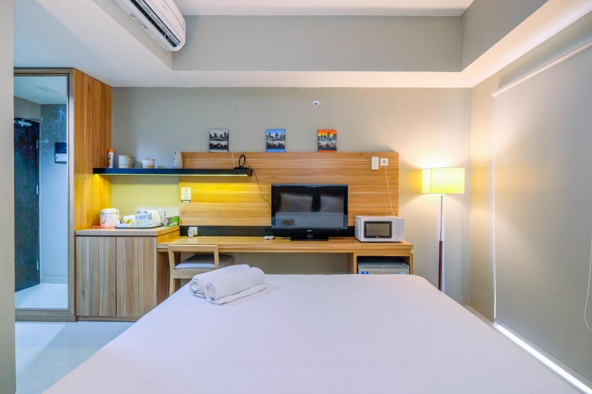 Stylish and Cozy Studio No Kitchen Apartment Mustika Golf Residence By Travelio - Housity