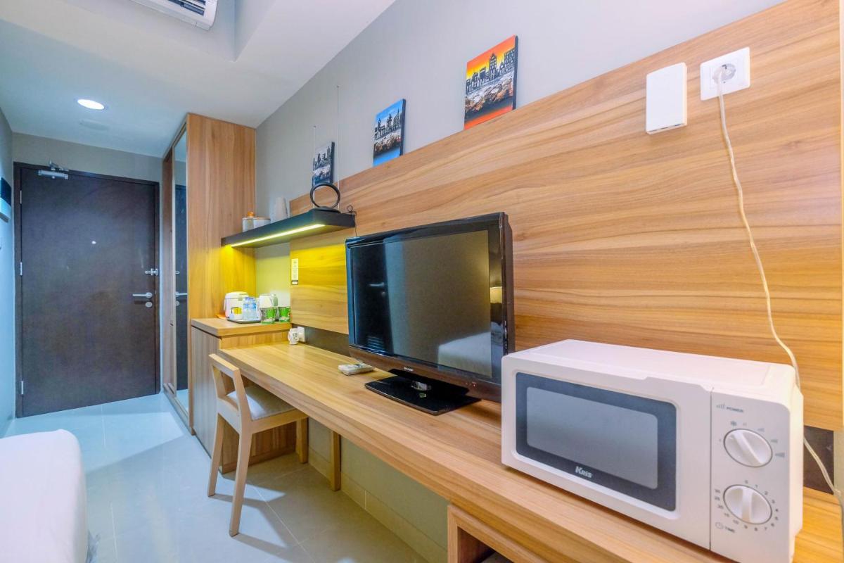 Stylish and Cozy Studio No Kitchen Apartment Mustika Golf Residence By Travelio - Housity