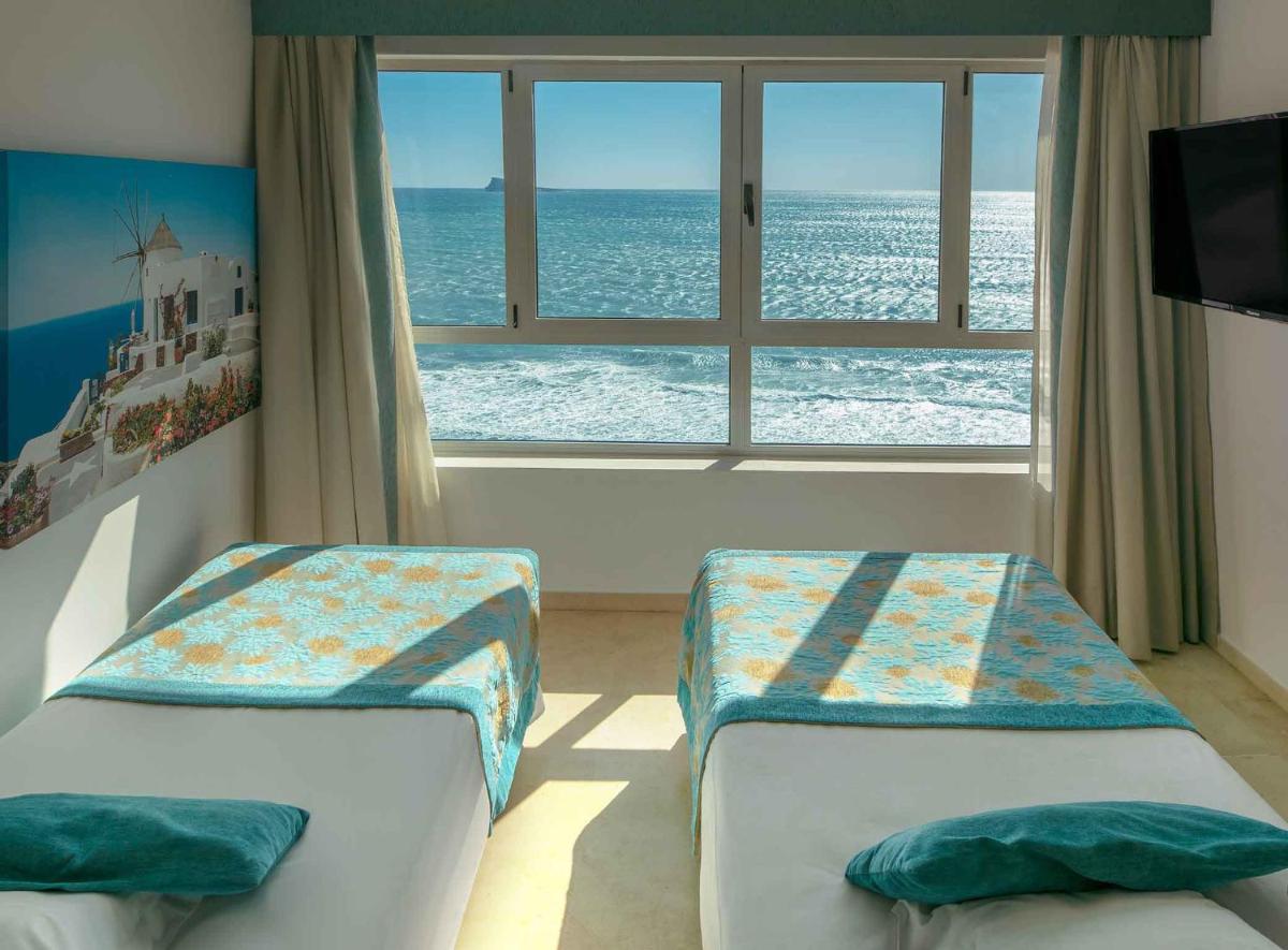 Cama o camas de una habitación en Hotel Villa del Mar