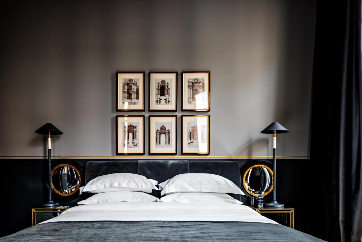 Un ou plusieurs lits dans un hébergement de l'établissement Monsieur George Hotel & Spa - Champs-Elysées