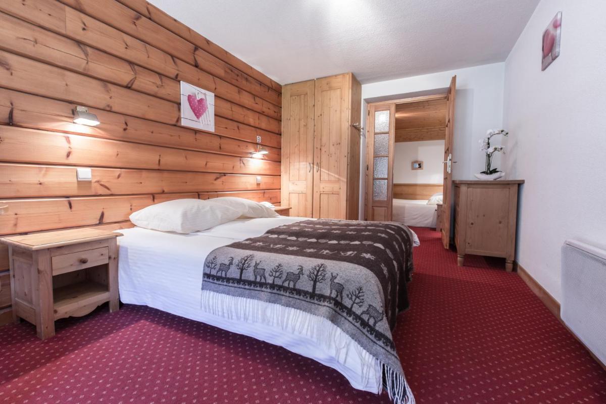 Un ou plusieurs lits dans un hébergement de l'établissement Hotel Club Le Crêt