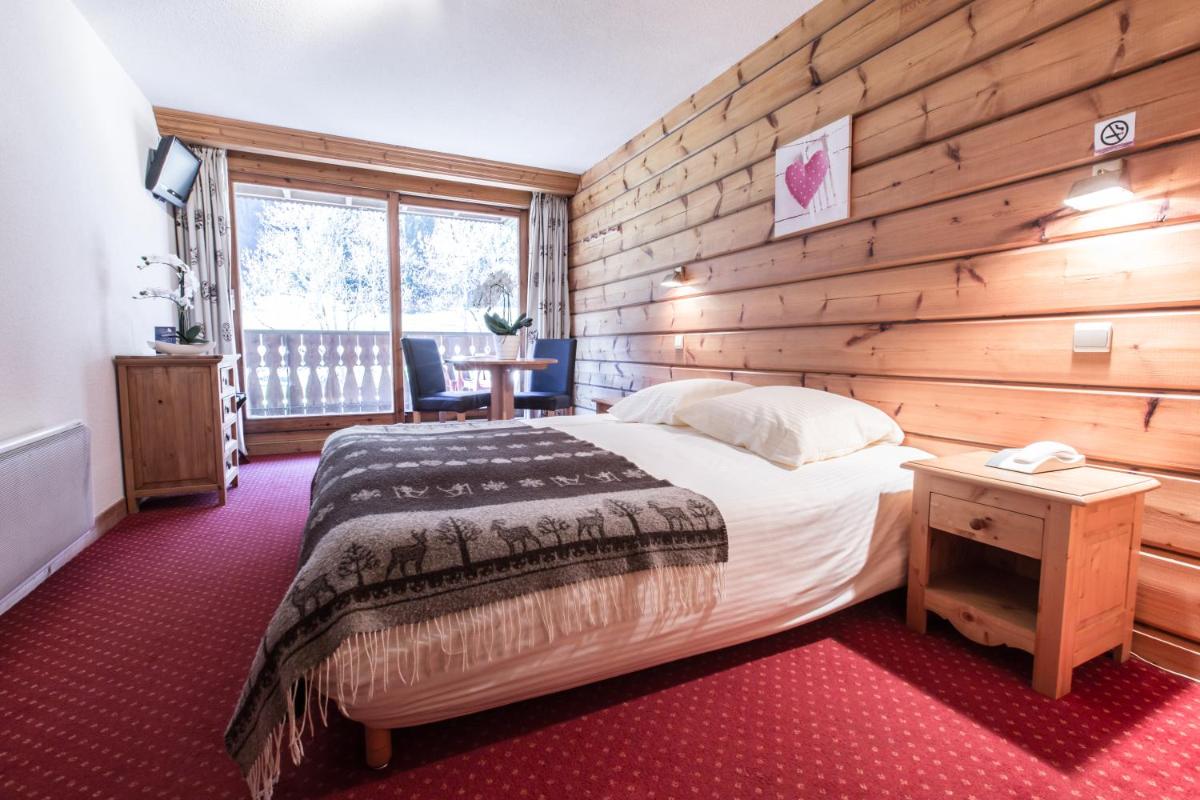 Un ou plusieurs lits dans un hébergement de l'établissement Hotel Club Le Crêt