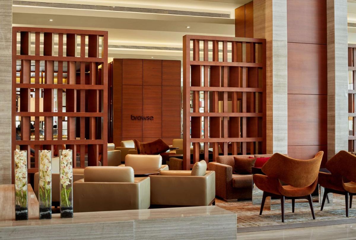 a lobby of a hotel with couches and chairs at Hyatt Regency Chandigarh in Chandīgarh