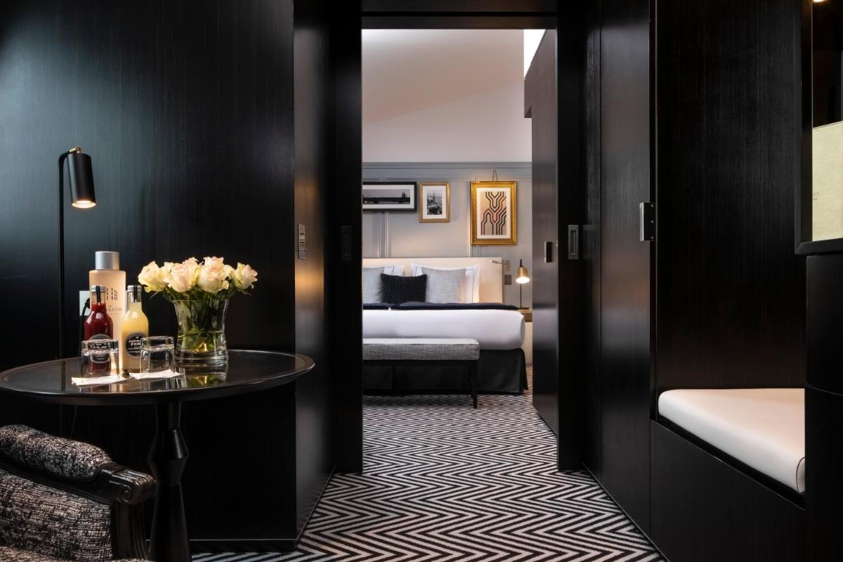 Un ou plusieurs lits dans un hébergement de l'établissement Le Damantin Hôtel & Spa