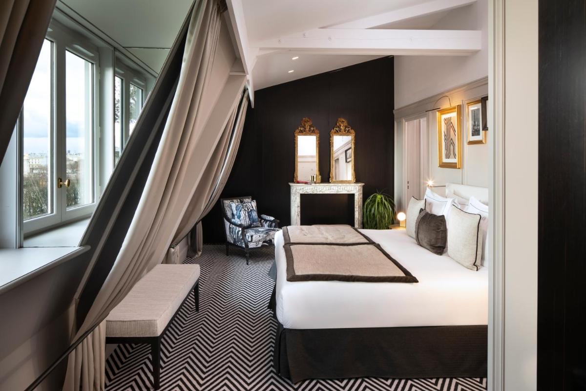 Un ou plusieurs lits dans un hébergement de l'établissement Le Damantin Hôtel & Spa