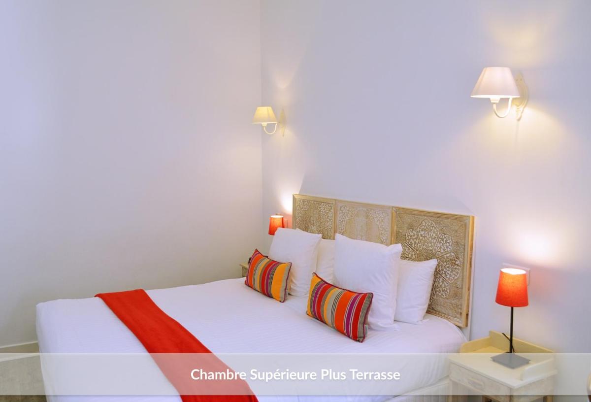 Un ou plusieurs lits dans un hébergement de l'établissement Hôtel & Espace Bien-être La Maison du Lierre