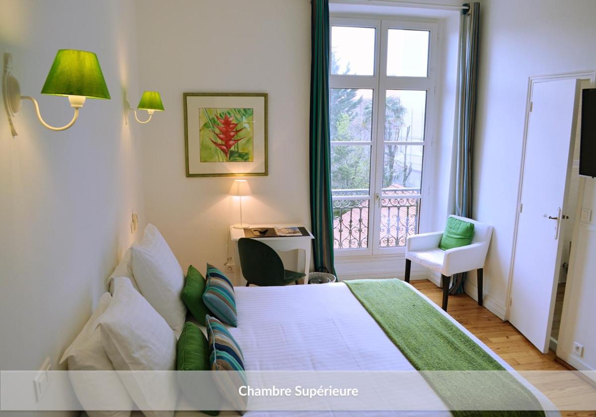 Un ou plusieurs lits dans un hébergement de l'établissement Hôtel & Espace Bien-être La Maison du Lierre