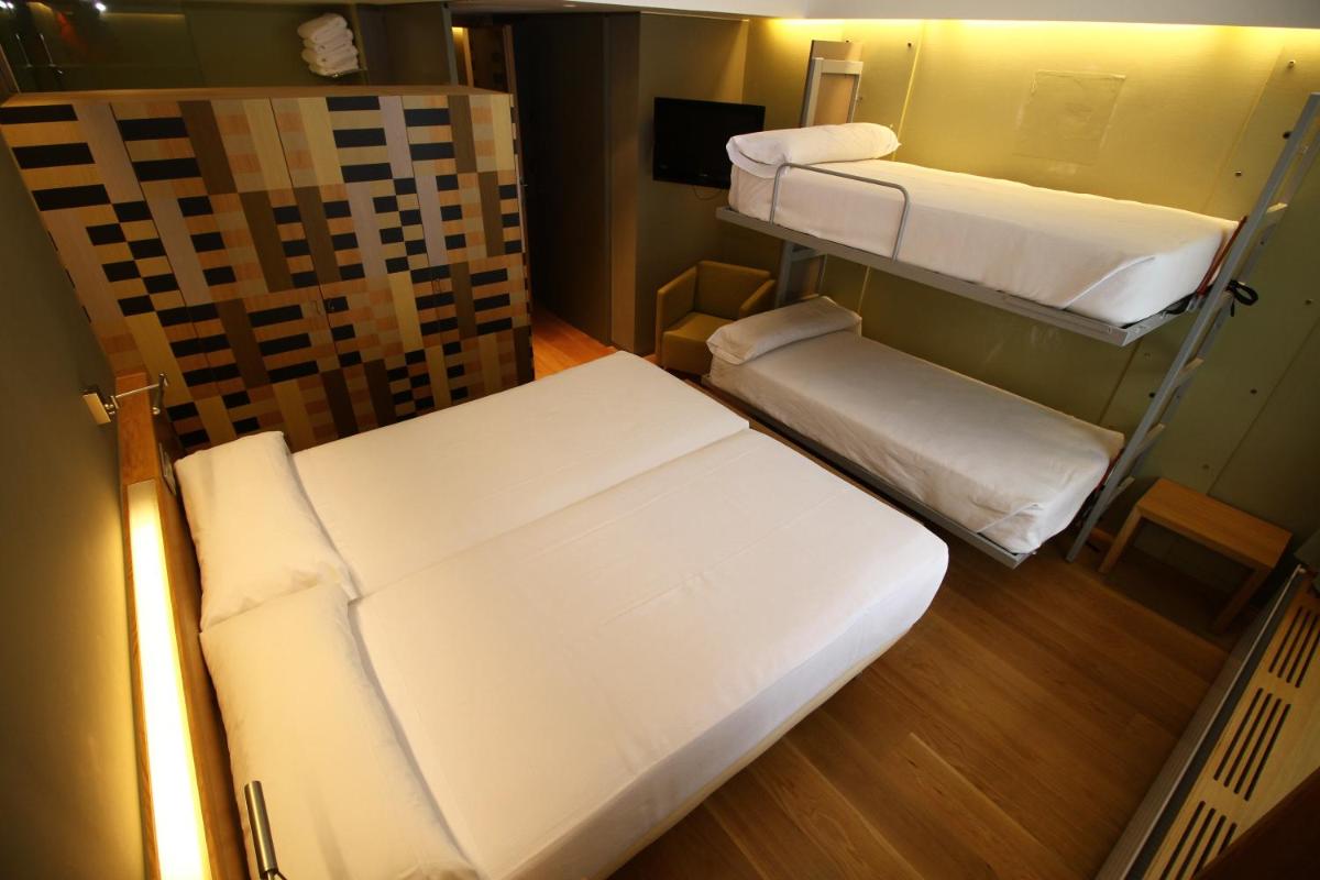 Cama o camas de una habitación en Hotel Continental Balneario de Panticosa