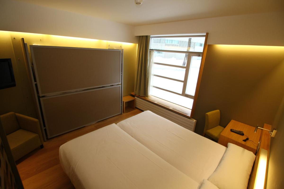 Cama o camas de una habitación en Hotel Continental Balneario de Panticosa