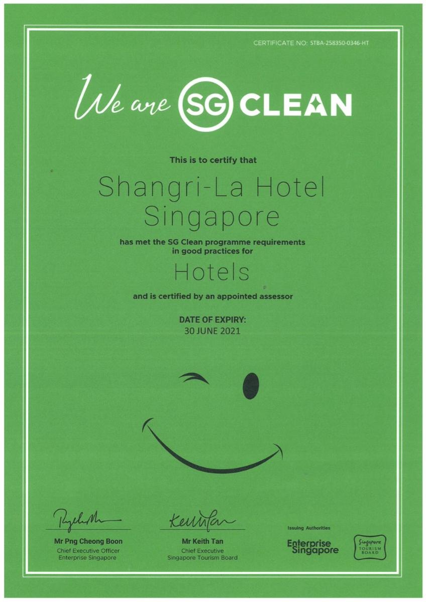 a green sign with a smiley face on it at Shangri-La Singapore in Singapore a green sign with a smiley face on it at Shangri-La Singapore in Singapore