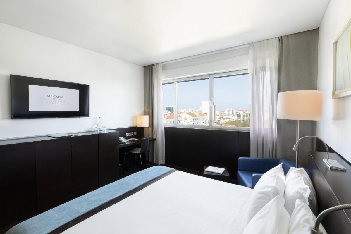 Uma cama ou camas num quarto em VIP Grand Lisboa Hotel & Spa