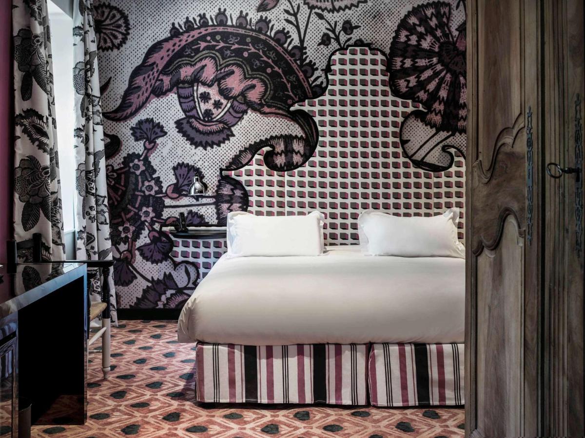 Un ou plusieurs lits dans un hébergement de l'établissement Jules César Hotel & Spa Arles - MGallery Collection