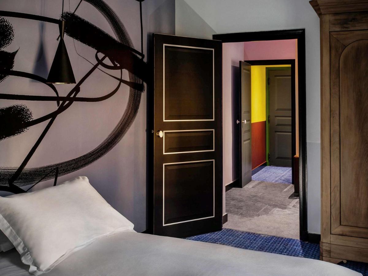 Un ou plusieurs lits dans un hébergement de l'établissement Jules César Hotel & Spa Arles - MGallery Collection