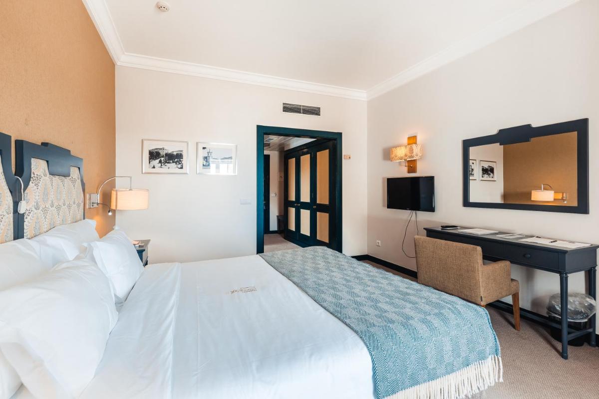 Uma cama ou camas num quarto em Conimbriga Hotel do Paço