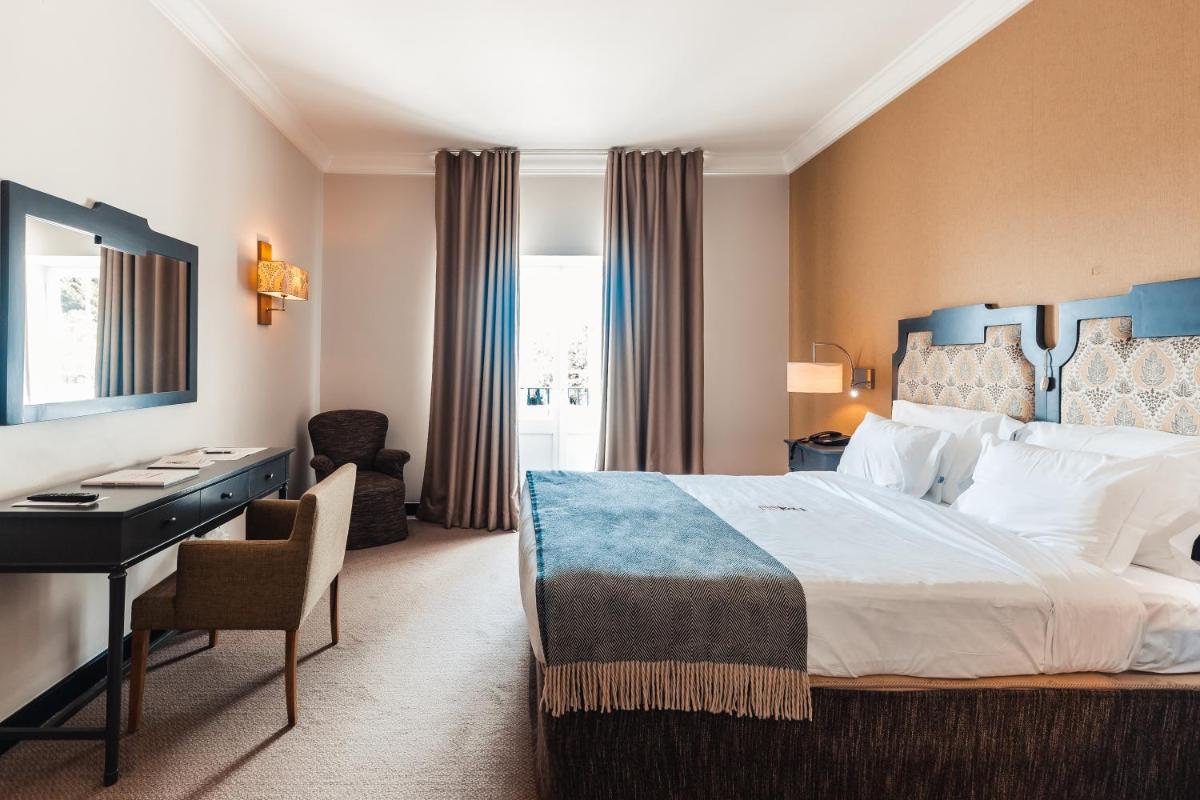 Uma cama ou camas num quarto em Conimbriga Hotel do Paço