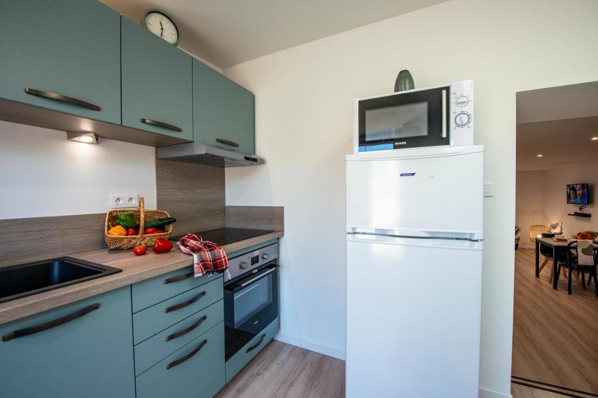 Cuisine ou kitchenette dans l'établissement Résidence Les Océanes