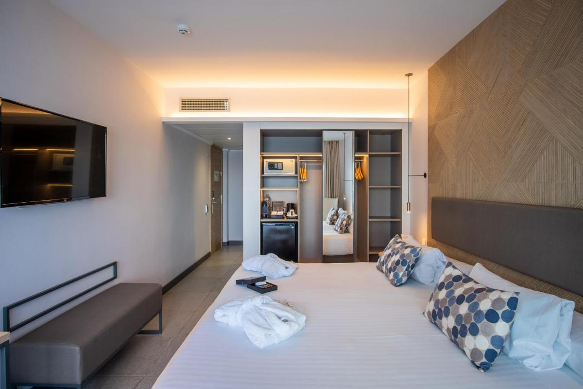 Cama o camas de una habitación en Hotel Cap Negret