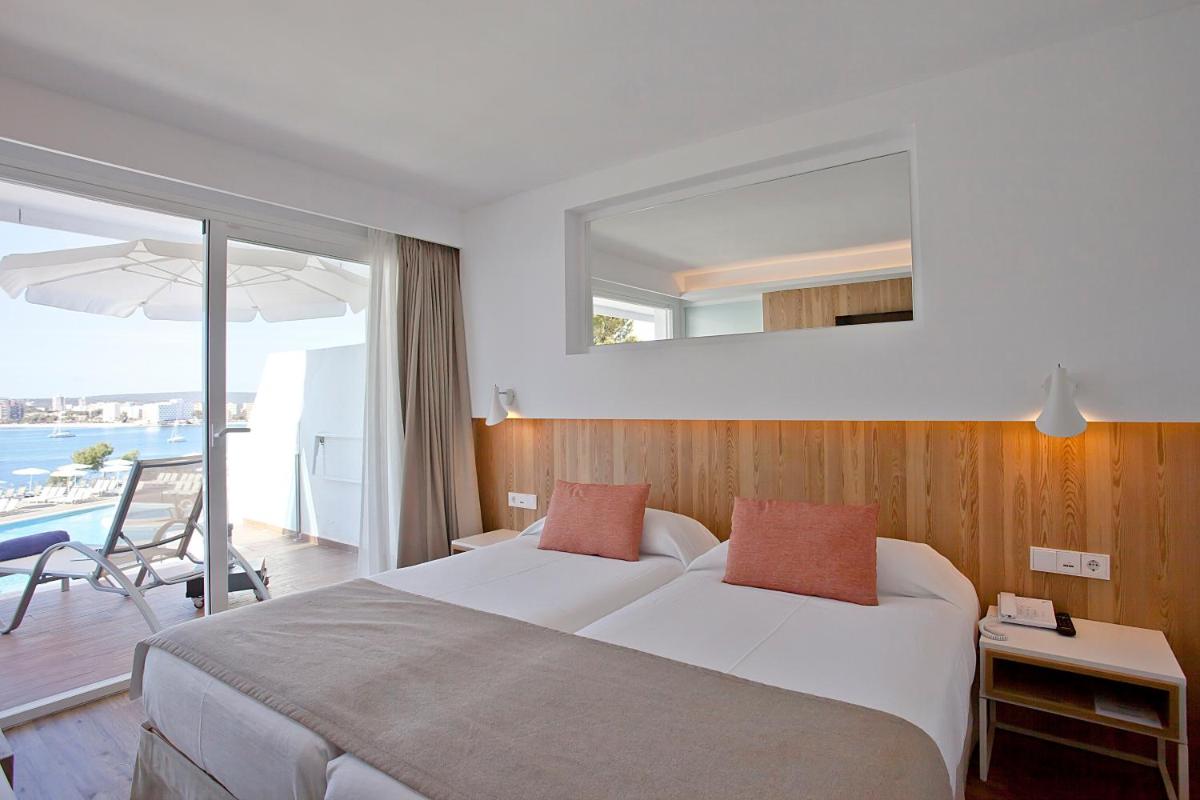 Cama o camas de una habitación en Aparthotel Ponent Mar