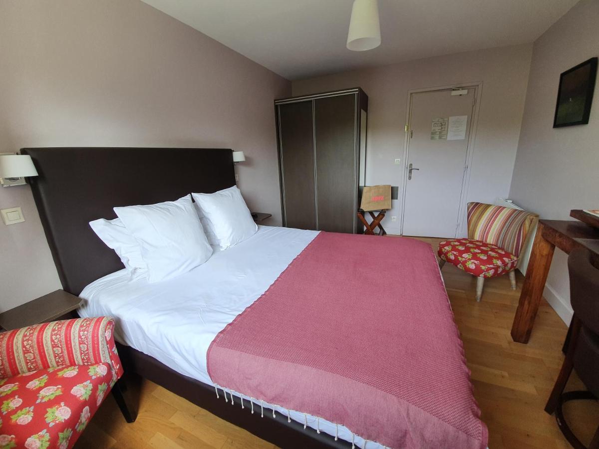 Un ou plusieurs lits dans un hébergement de l'établissement La Fraîchette-Hôtel & Spa