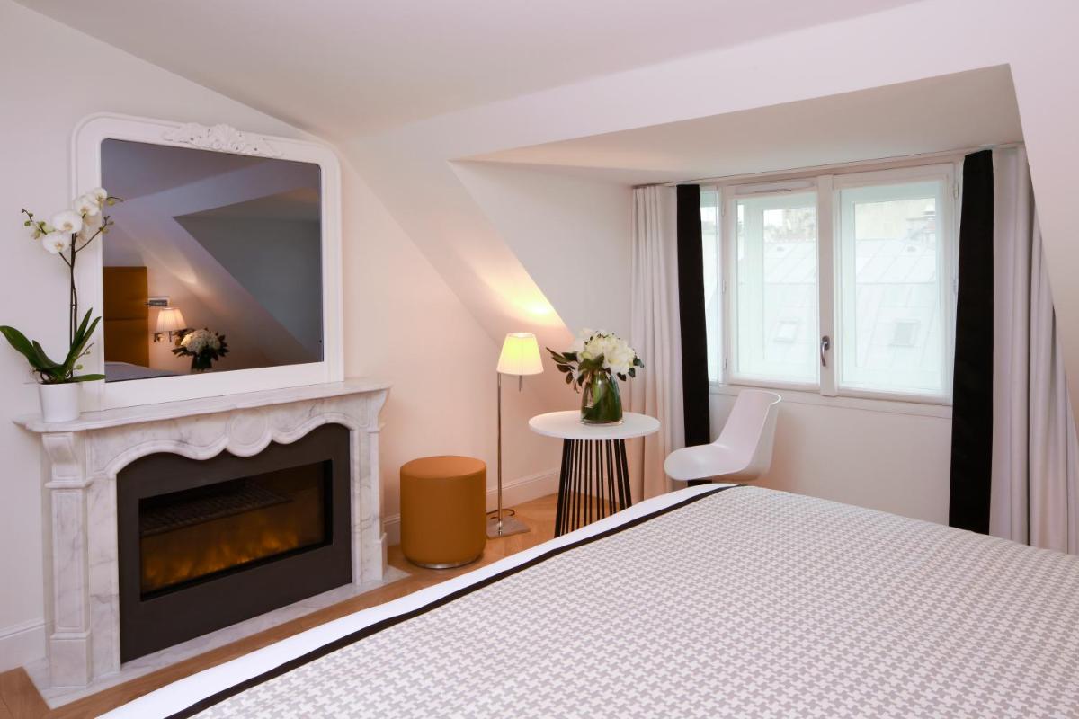 Un ou plusieurs lits dans un hébergement de l'établissement Hôtel R de Paris - Boutique Hotel