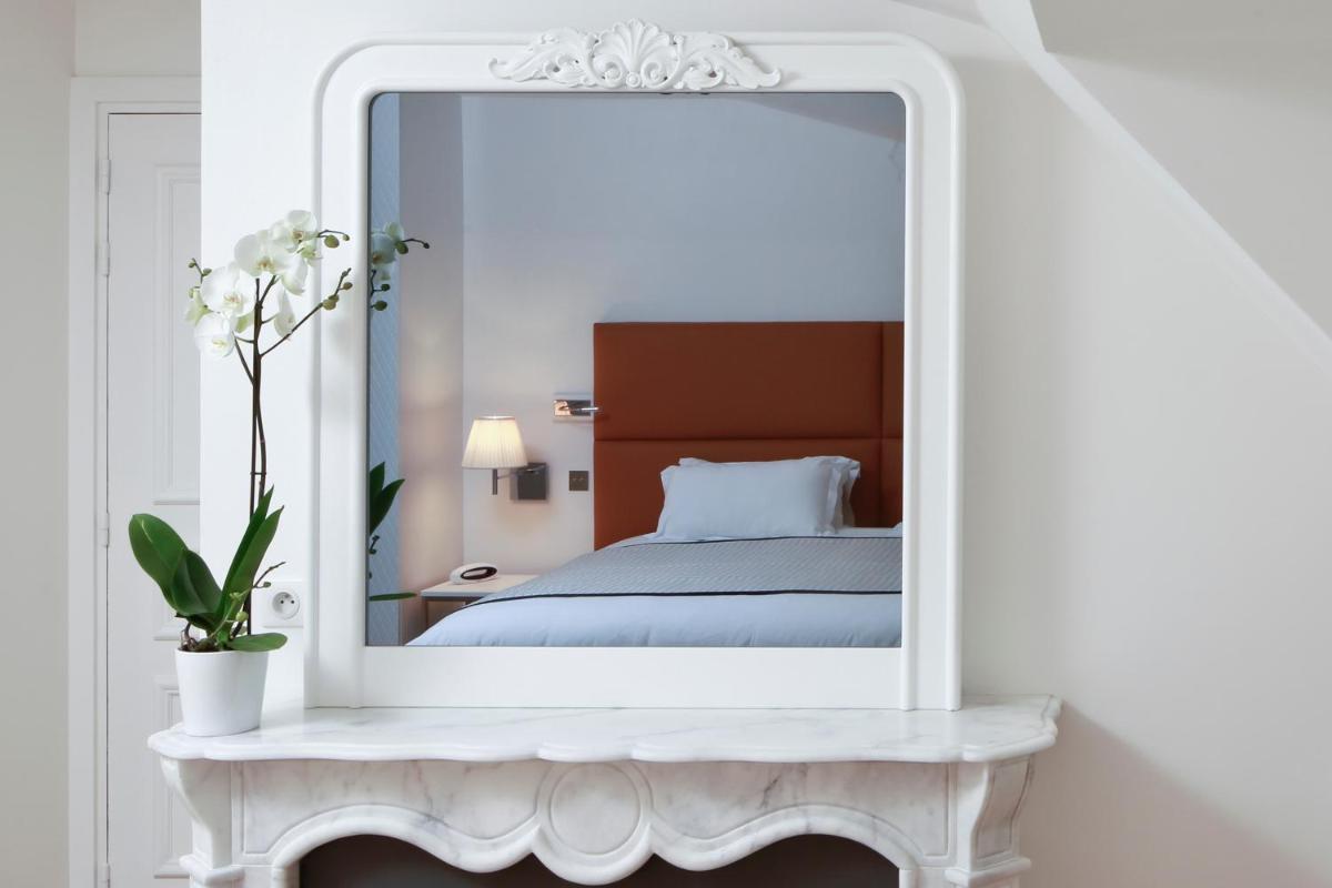Un ou plusieurs lits dans un hébergement de l'établissement Hôtel R de Paris - Boutique Hotel