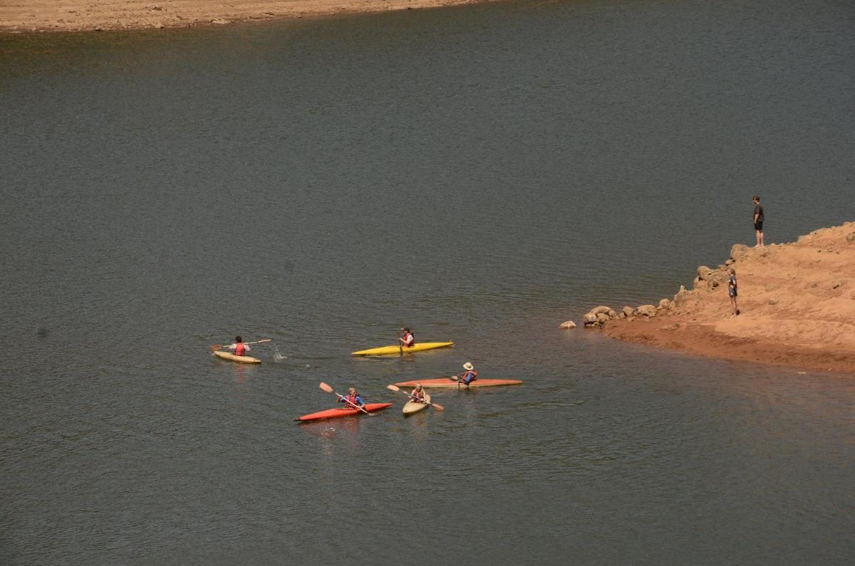 a group of people in kayaks in the water at Savoy - IHCL SeleQtions in Ooty
