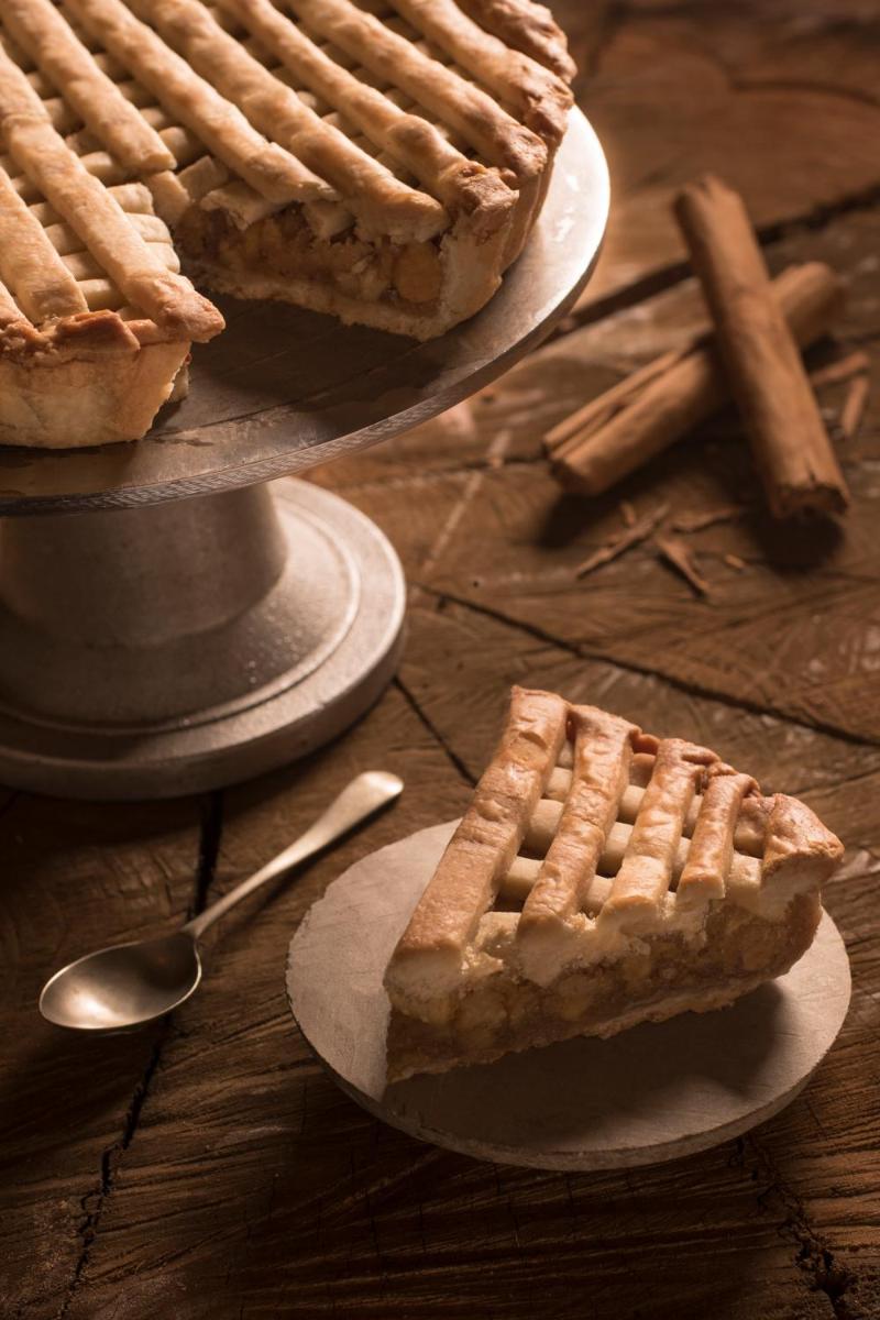 two plates of pies on a table with a cross at Savoy - IHCL SeleQtions in Ooty